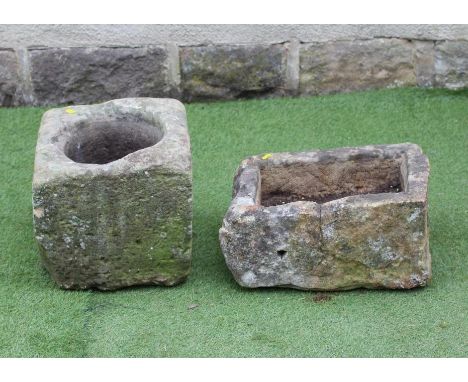 A SMALL SANDSTONE TROUGH of irregular rough hewn oblong form, 20" x 13 1/4" x 10 1/4", together with a square sandstone plant