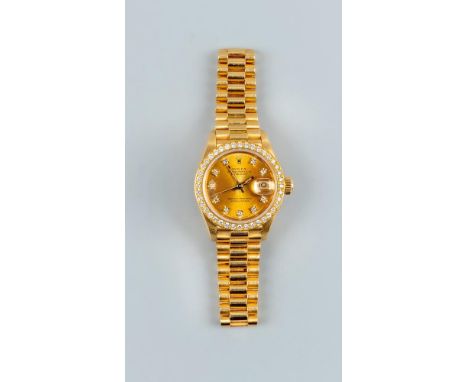 A LADY'S 18CT GOLD AND DIAMOND ROLEX OYSTER PERPETUAL DATEJUST SUPERLATIVE CHRONOMETER, the gilt dial with diamond markers, d