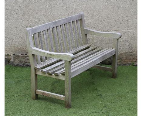 A TEAK BENCH, modern, the slatted back with straight top rail, slatted seat, mildly scrolled arm terminals, on square section