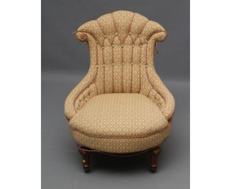 A VICTORIAN WALNUT FRAMED NURSING CHAIR button upholstered in a cream, green and rust weave, the arched fan shaped ribbed bac