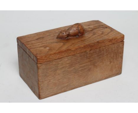 A ROBERT THOMPSON ADZED OAK TRINKET BOX of oblong form, the detachable lid surmounted by a carved mouse trademark in high rel
