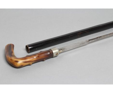 A SWORD STICK BY TOLEDO, late 19th/early 20th century, the button released 27 1/4" blade acid etched with maker's name amid f