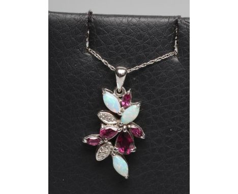 AN ALMANDINE GARNET AND OPAL ABSTRACT PENDANT set with five pear and other cut garnets and three eliptical polished opals, an