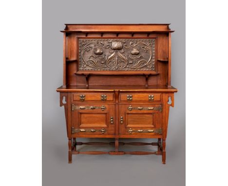 AN ARTS AND CRAFTS STYLE MAHOGANY SIDEBOARD, the raised back with large central copper panel embossed with stylised foliate, 