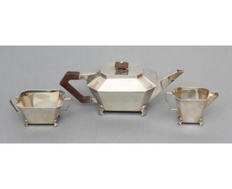 AN ART DECO COMPOSITE THREE PIECE TEA SERVICE, maker C.S. Green &amp; Co., Birmingham 1935/6, of plain canted oblong form rai