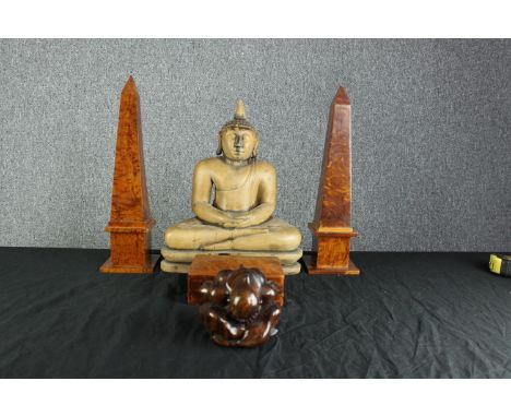A collection of hardwood items. Two Buddhas, two matching Obelisks, and a Tea caddy. The two obelisks measure H.40 cm are fin