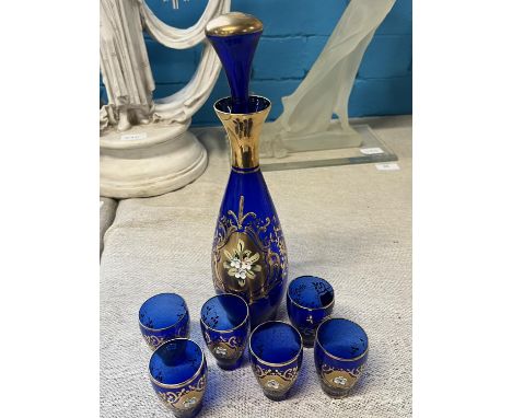 A Bohemian blue glass decanter and six small glasses 