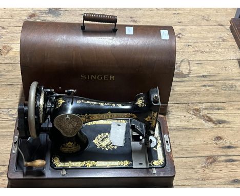 A vintage manual Singer sewing machine. Shipping unavailable 