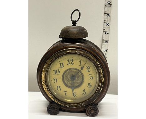 A early 20th century alarm clock in mahogany case works intermittently 
