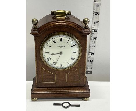 A vintage mahogany cased mantle clock with key, French manufactuer 