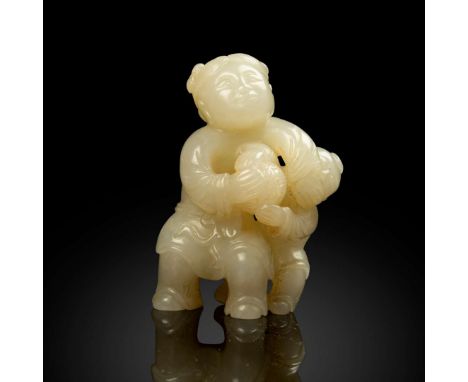  CHINESE WHITE JADE CARVING OF BOYS PLAYING BALL QING DYNASTY 清 白玉雕童子戲球擺件lively carved with two boys playfully wrestling for 