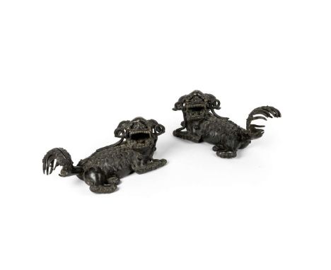  LARGE PAIR OF CHINESE BRONZE BUDDHIST LION DOGS MING DYNASTY, 17TH CENTURY 明 銅鑄大佛獅 (一對)cast in mirror form, each with its he