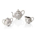 CHINESE EXPORT SILVER 'CHRYSANTHEMUM' THREE-PIECE TEA SERVICE