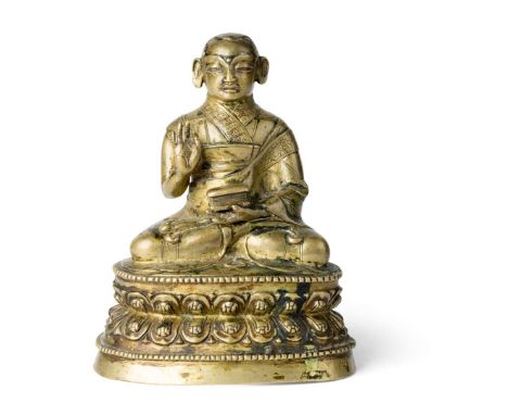  SINO-TIBETAN BRONZE SEATED LAMA QING DYNASTY 清 銅喇嘛座像seated in dhyanasana on a double-lotus base with his right hand raised i