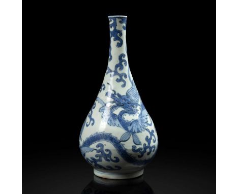 CHINESE BLUE AND WHITE 'WINGED DRAGON' BOTTLE VASE MING DYNASTY 明 青花雙翼龍紋膽瓶of pear form, painted around the body with two sinu