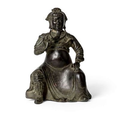  CHINESE BRONZE FIGURE OF GUANDI QING DYNASTY, 17TH-18TH CENTURY 清 銅鑄關帝捻鬚座像the god of war shown seated with his left hand res