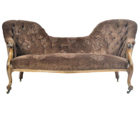 A Victorian 19th century Chesterfield double bed chaise longue sofa settee being raised on cabriole legs with castors having 