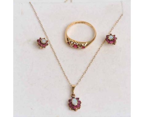 RUBY AND DIAMOND RING
the three round rubies separated by brilliant cut diamonds, in a pierced setting, hallmarked for eighte