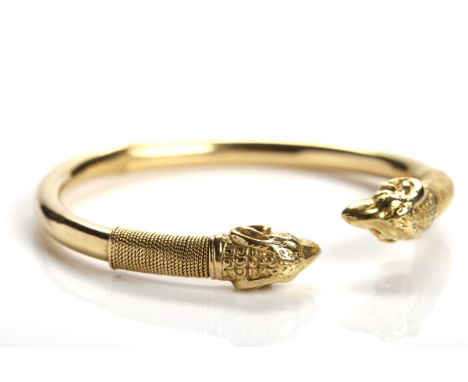 GOLD RAM'S HEAD TORC BANGLE
the ends each with a ram's head motif, unmarked, 20.7g