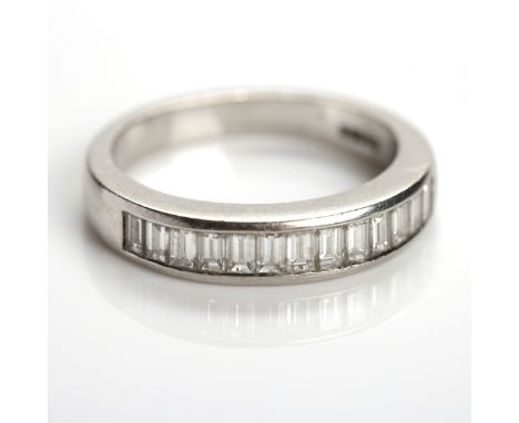 DIAMOND HALF ETERNITY RING
channel set with thirteen baguette cut diamonds, in platinum, size K