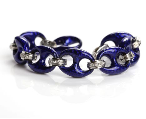 UNUSUAL DIAMOND AND ENAMEL BRACELET
with large oval blue enamel links, interspaced by diamond set links, in eighteen carat wh