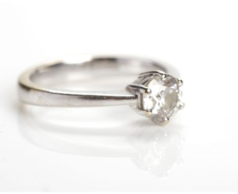 DIAMOND SOLITAIRE RING 
the brilliant cut diamond approximately 0.67 carats, in eighteen carat white gold, size J-K