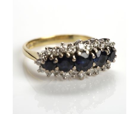 FIVE STONE SAPPHIRE AND DIAMOND CLUSTER RING
with five round sapphires, surrounded by a cluster of brilliant cut diamonds, ha