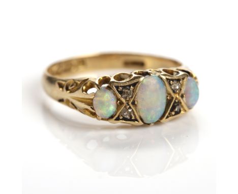 EDWARDIAN OPAL AND DIAMOND DRESS RING
Victorian style, set with three oval opals, interspaced by diamonds, hallmarked for eig