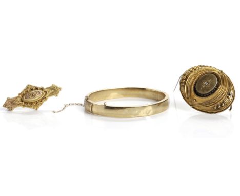 COLLECTION OF GOLD JEWELLERY
comprising of a nine carat gold bangle, a diamond set Victorian brooch with glazed panel to reve