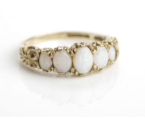 VICTORIAN STYLE OPAL DRESS RING
set with five graduated oval cabochon opals, in nine carat gold, size N