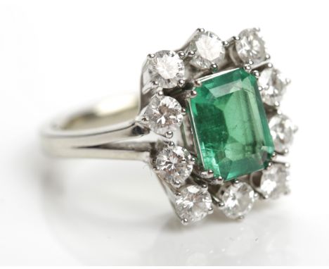 CERTIFICATED COLOMBIAN EMERALD AND DIAMOND CLUSTER RING
the step cut emerald approximately 1.44 carats, surrounded by brillia