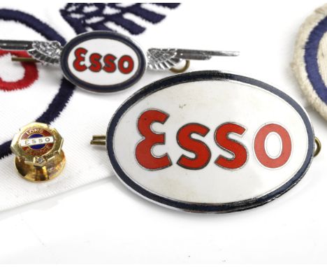 NINE CARAT GOLD ESSO 10 YEARS LONG SERVICE TIE PIN
of circular form, set with a single brilliant cut diamond, with enamelled 