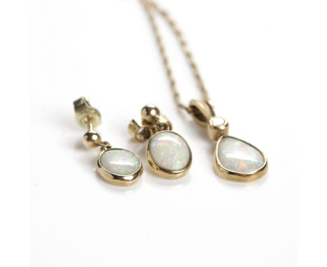 OPAL AND DIAMOND PENDANT
set with a single pear shaped opal approximately 9.5mm long, below a single round diamond, in nine c