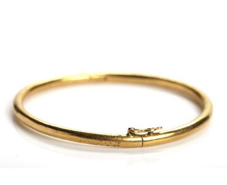 CHINESE TWENTY TWO CARAT GOLD BANGLE
with Chinese marks and letter E, 14.6gms