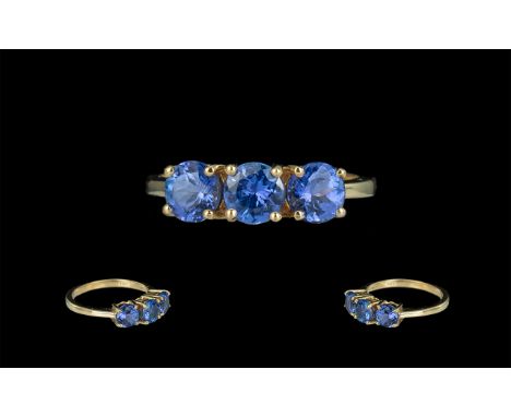 Iliana 18ct Gold Three Stone Blue Sapphire Set Dress Ring marked 18ct and Iliana to interior of shank, the three round facete