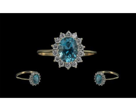 Ladies Attractive 9ct Gold Aquamarine and Diamond Set Cluster Ring. Full Hallmark to Interior of Shank. The Aquamarine of Exc