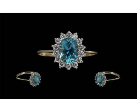 Ladies Attractive 9ct Gold Aquamarine and Diamond Set Cluster Ring. Full Hallmark to Interior of Shank. The Aquamarine of Exc