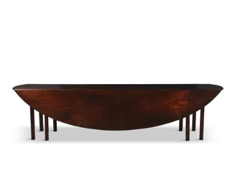 A LARGE MAHOGANY HUNT TABLE, with gate-leg action and twin drop-leaf sides on squared legs, extending to an oval shape. 75cm 