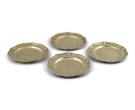 A SET OF FOUR GEORGE II SILVER GILT DINNER PLATES,London 1729, of shaped circular form, with gadroon ruins and engraved bandi