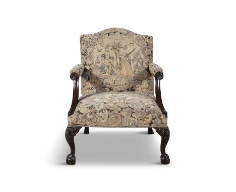 A GEORGE III MAHOGANY FRAMED GAINSBOROUGH ARMCHAIR the arched padded back and seat covered in a tapestry fabric, the armrests