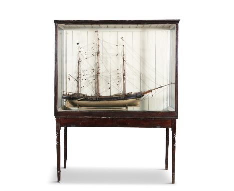 A LARGE FULL HULL THREE-MAST SHIP MODEL, LATE 19TH CENTURYcontained within a glazed case, and raised on fitted stand, bearing