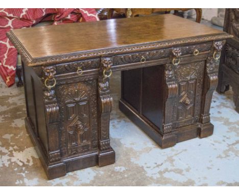 PEDESTAL DESK, late 19th century Continental oak with three drawers above carved panel doors, 80cm H x 137cm x 74cm.