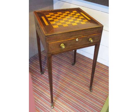 GAMES TABLE, George III mahogany, rosewood and satinwood, circa 1790, with a reversible sliding chess board top and a tooled 