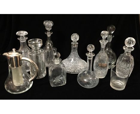 A COLLECTION OF NINE 19TH CENTURY AND LATER, LEAD GLASS DECANTERS To include a cut glass ships decanter and a 19th Century lo