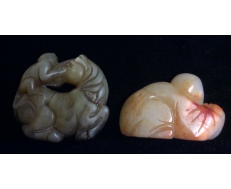 AN ORIENTAL TANG DYNASTY STYLE JADE CARVING OF A RECUMBENT HORSE AND MONKEY Together with a carving of Buddha holding a preci