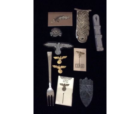 A COLLECTION OF WORLD WAR II GERMAN MILITARY ITEMS To include a silver plated SS fork, marked 'Suhrerheim JB', an SS officers