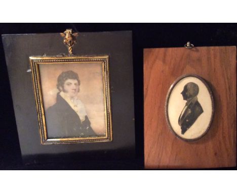 A LATE 18TH/EARLY 19TH CENTURY IVORY MINIATURE PORTRAIT  Of a distinguished gentleman, with dark hair and large sideburns, we