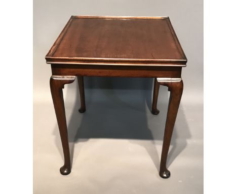 A 19TH CENTURY MAHOGANY OCCASIONAL CARD TABLE The reversible top concealing a green baize playing surface, with wells raised 