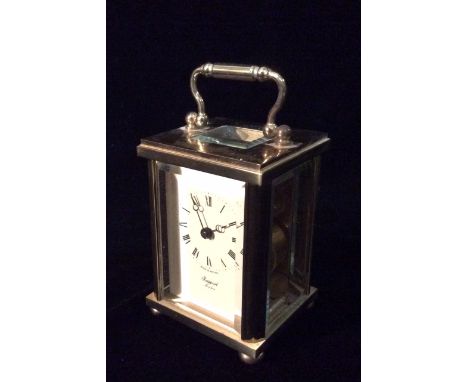 RAPPORT, LONDON, A 20TH CENTURY GILT BRASS CARRIAGE CLOCK With a swan neck handle, with rectangular platform aperture and fou