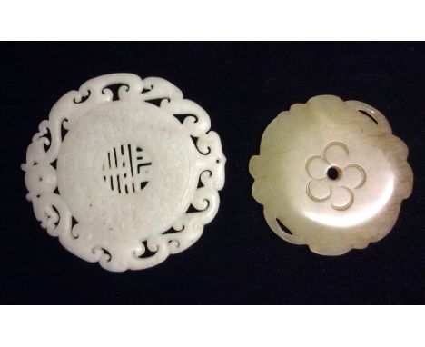 AN ORIENTAL JADE 'BI' DISC CARVING   With pierced mythical beasts to outer edge, the central cartouche having Oriental style 